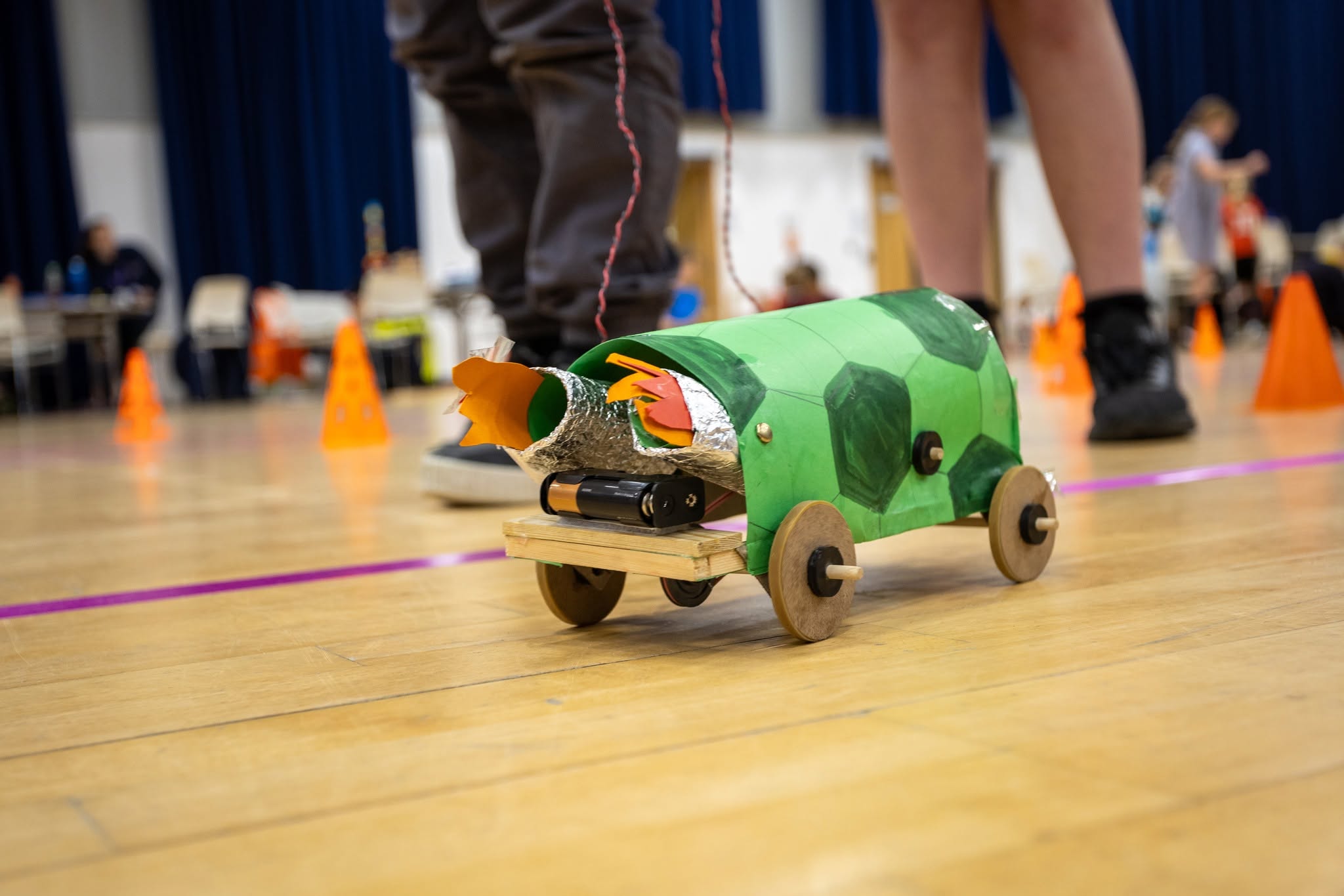 An image of a handmade vehicle on the floor